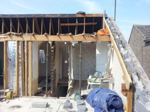 Taking apart the roof of a house