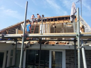 Taking apart the roof of a house